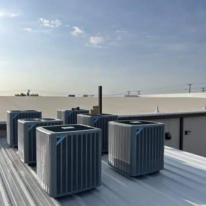 Multiple Daikin rooftop HVAC units on commercial building